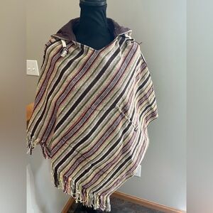 Women’s poncho boho reversible woven stripe and brown fringe hooded. One size